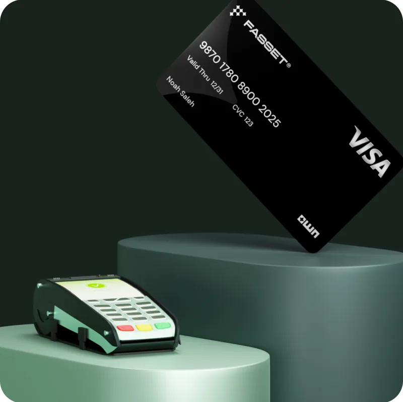A black Fasset Visa card beside a card payment terminal.